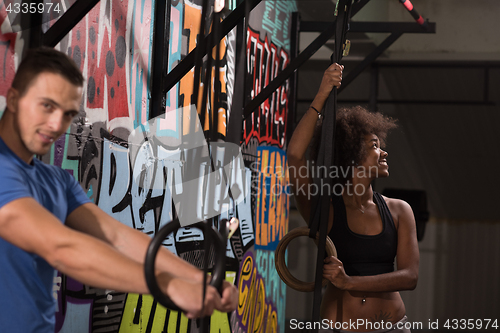 Image of Portrait of multiethnic couple  after workout at gym