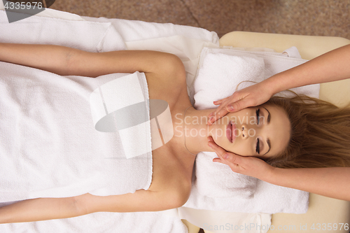 Image of woman receiving a head massage