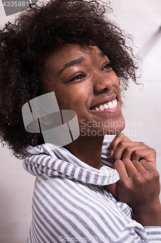 Image of beautiful black woman wearing  bathrobe