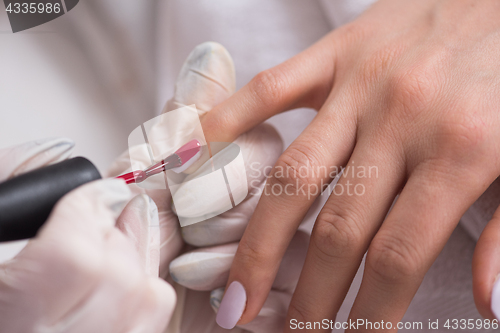 Image of Woman hands receiving a manicure