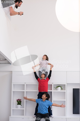 Image of young boys posing line up piggyback