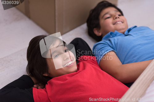 Image of young boys having fun on the floor