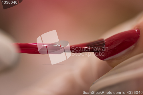 Image of Woman hands receiving a manicure