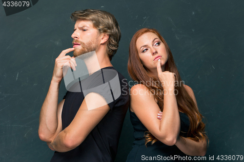 Image of Young couple remembering and thinking about something