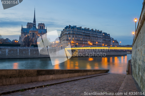 Image of Notre Dame Cathedral with Paris cityscape at dus