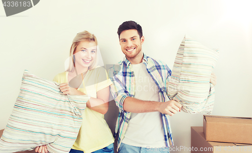 Image of happy couple with stuff moving to new home