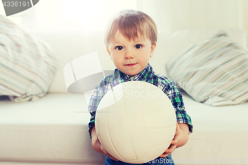 Image of happy little baby boy with ball at home