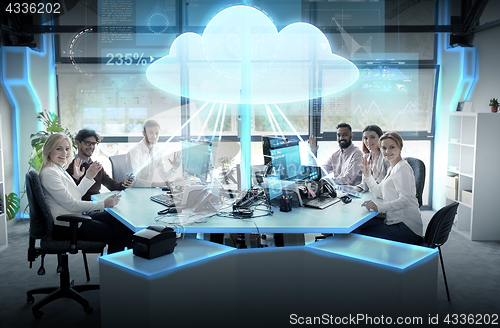 Image of happy business team with cloud computing hologram