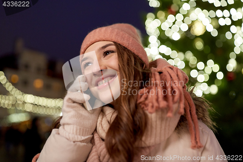 Image of happy woman calling on smartphone at christmas