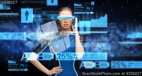 Image of woman in virtual reality 3d glasses with charts