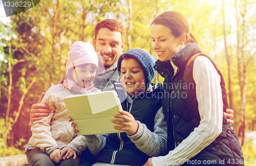 Image of happy family with tablet pc at camp