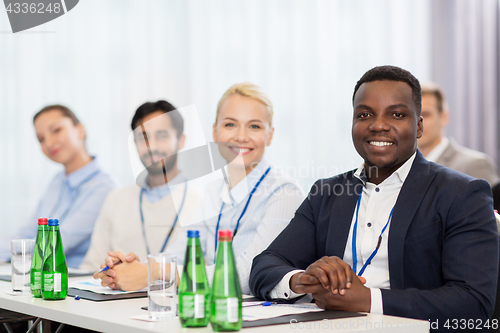 Image of happy business team at international conference