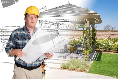 Image of Male Contractor With House Plans Wearing Hard Hat In Front of Cu