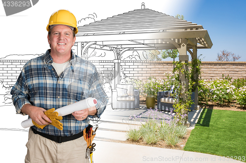 Image of Male Contractor With House Plans Wearing Hard Hat In Front of Cu