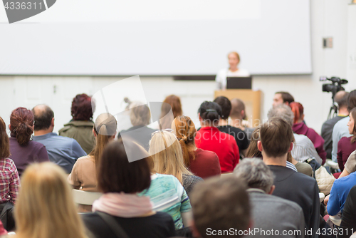 Image of Woman giving presentation on business conference.