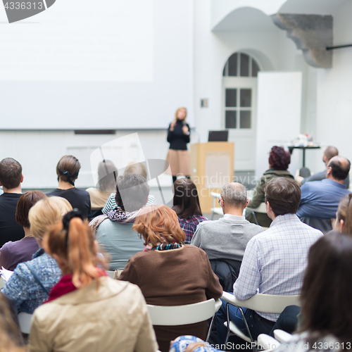 Image of Woman giving presentation on business conference.