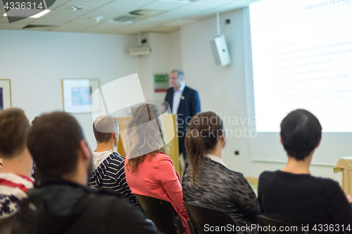 Image of Woman giving presentation on business conference.