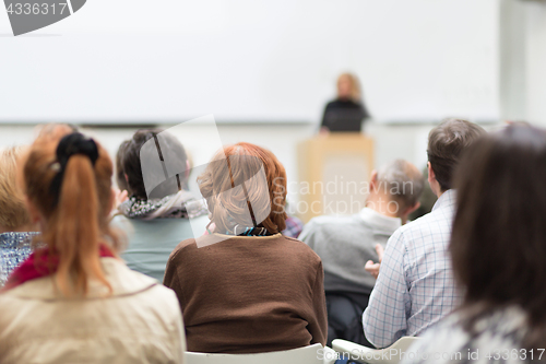 Image of Woman giving presentation on business conference.