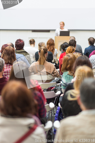 Image of Woman giving presentation on business conference.