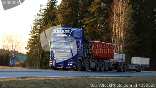 Image of Customized Blue Scania Trucking at Sunset