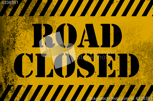 Image of Road closed  sign yellow with stripes