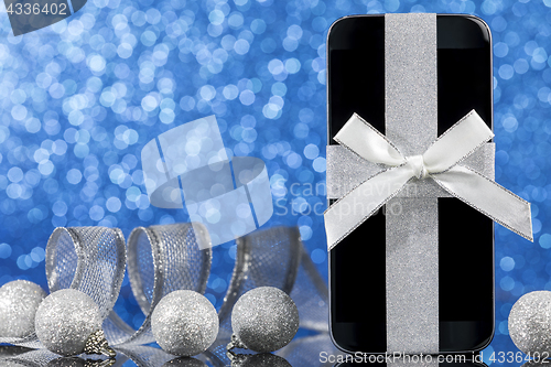 Image of Smartphone and decorations for Christmas 