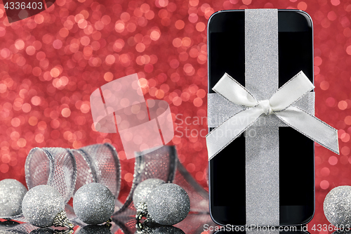 Image of Smartphone and decorations for Christmas