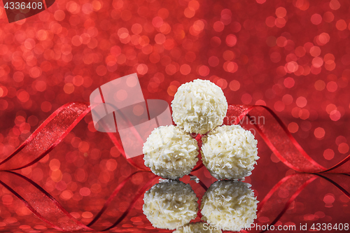 Image of White snowball Chocolate on glass table