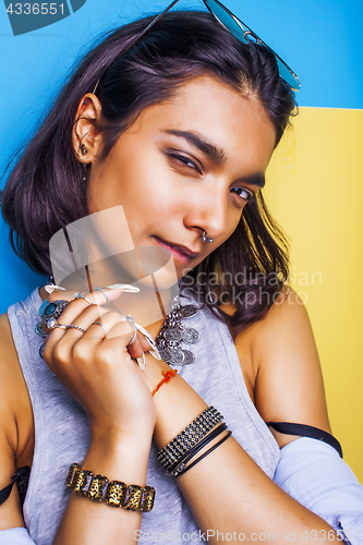 Image of lifestyle people concept. young pretty smiling indian girl with long nails wearing lot of jewelry rings, asian summer happy cool