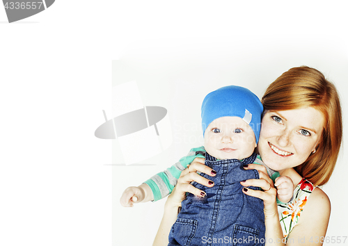 Image of young beauty mother with cute baby, red head happy modern family