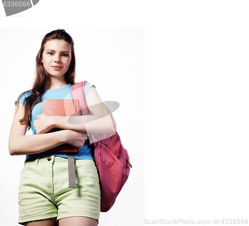 Image of young cute teenage girl posing cheerful against white background with books and backpack isolated copyspace