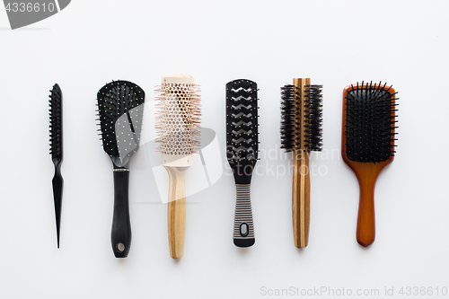 Image of different hair brushes or combs from top