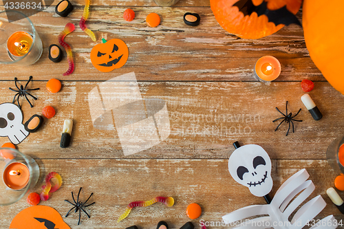 Image of halloween decorations with space on wooden boards