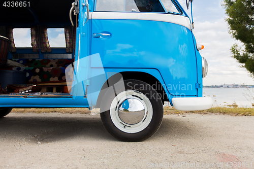 Image of close up of hippie minivan car at seaside