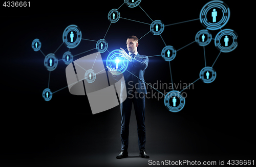 Image of businessman with virtual network contacts
