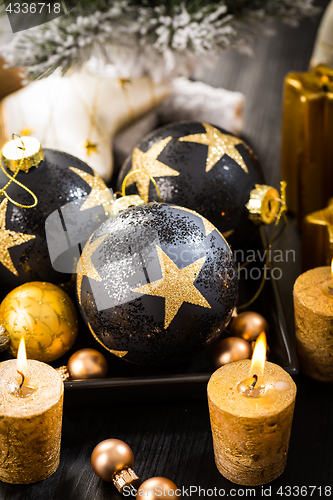 Image of Christmas balls with candles 