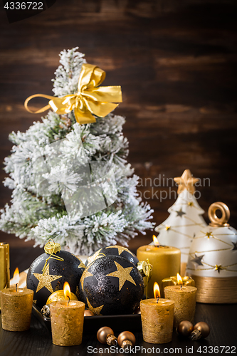 Image of Christmas balls with candles 