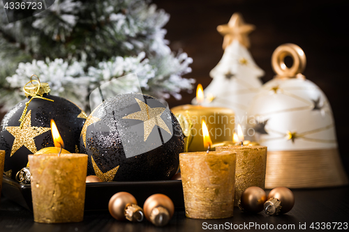 Image of Christmas balls with candles 