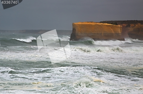 Image of Rough waves on sandstone shore