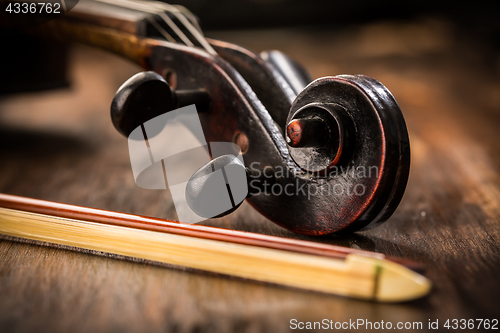 Image of Violin in vintage style on wood background