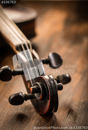 Image of Violin in vintage style on wood background