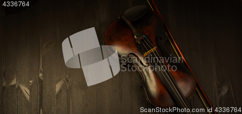 Image of Violin in vintage style on wood background