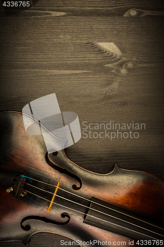 Image of Violin in vintage style on wood background