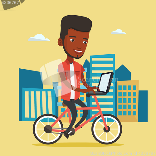 Image of African-american man riding bicycle in the city.