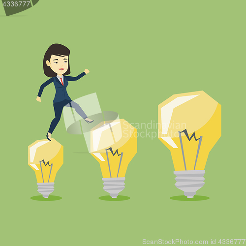 Image of Business woman jumping on light bulbs.
