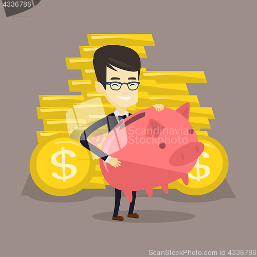 Image of Business man holding big piggy bank.