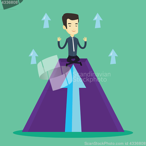 Image of Peaceful business man meditating in lotus pose.