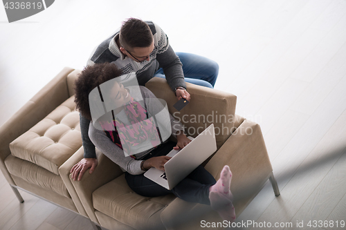 Image of multiethnic couple shopping online