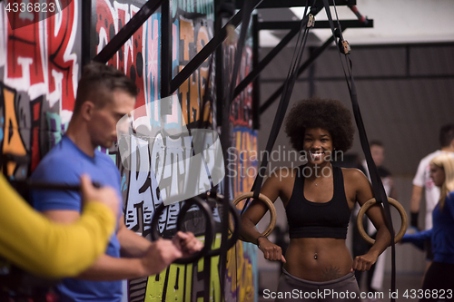 Image of Portrait of multiethnic couple  after workout at gym