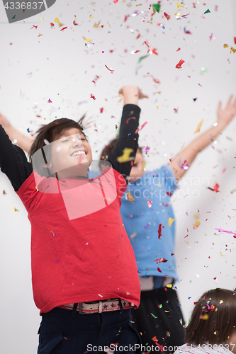 Image of kids  blowing confetti